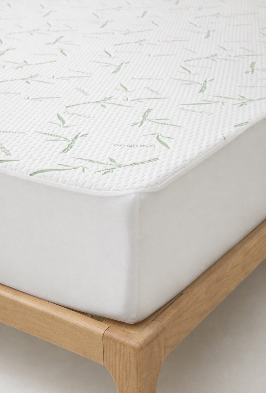 Close view of the mattress protector corner and fitted skirt construction