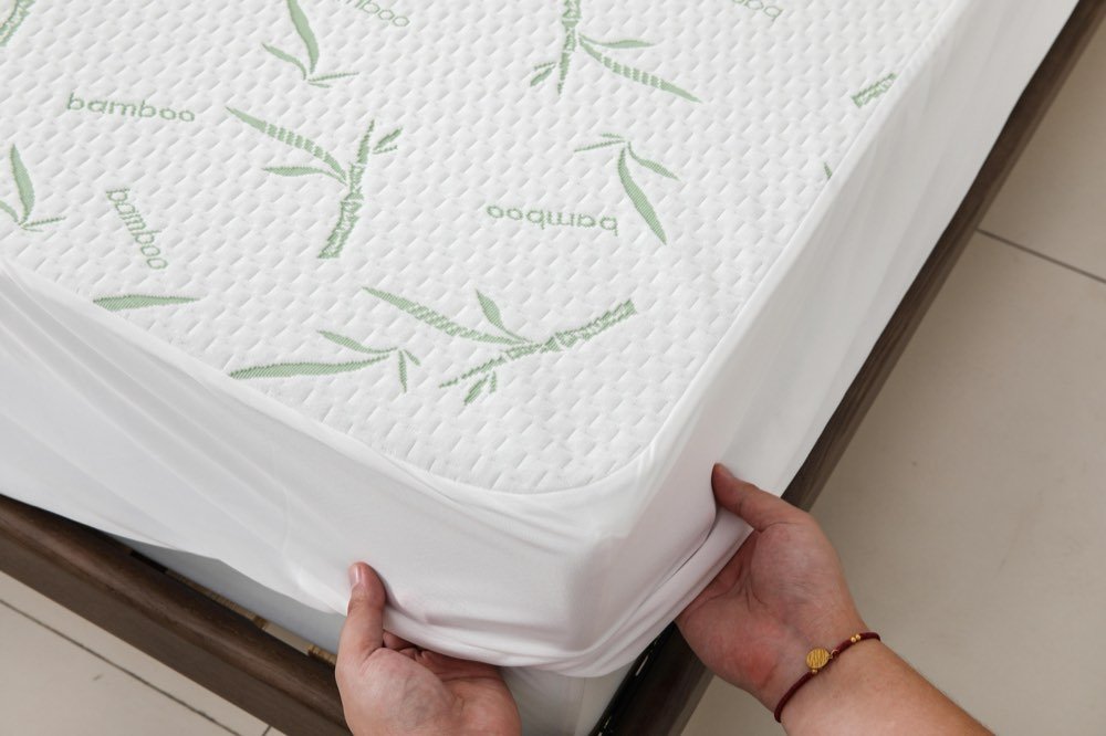 Dreamelix bamboo mattress protector fitted securely around a mattress corner